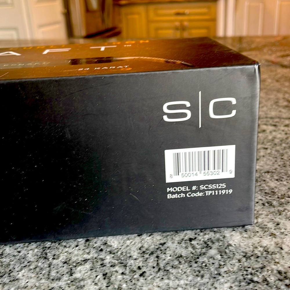 Brand new 1.25 inch curling iron by Style Craft.
